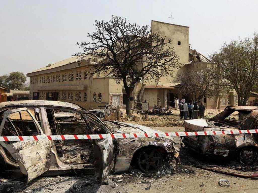 A security barrier marks the scene of a car bomb explosion at St. Theresa Catholic Church at Madalla, Suleja, just outside Nigeria's capital Abuja