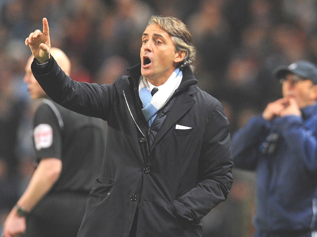 Roberto Mancini, the Manchester City manager, is interested in signing Daniele de Rossi from Roma during the transfer window