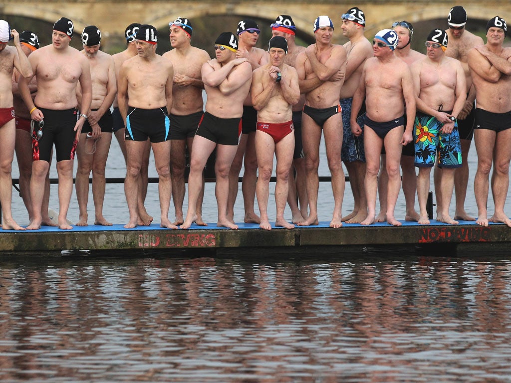 Members of the Serpentine Swimming Club take the plunge in London’s Hyde Park
