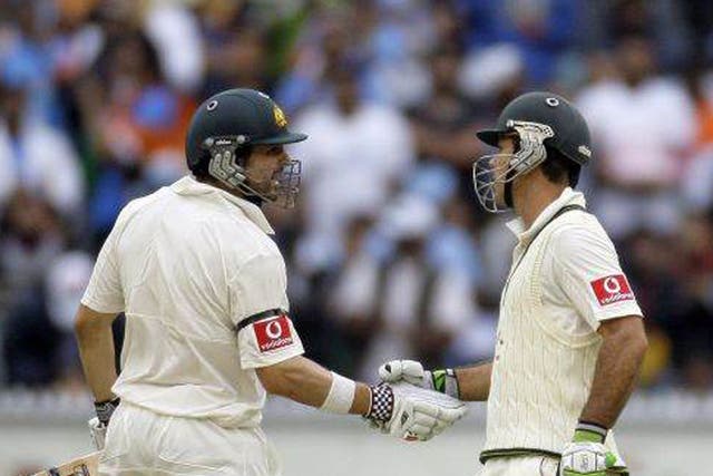 Rickey Ponting, right, of Australia is congratulated by teammate Ed Cowan 