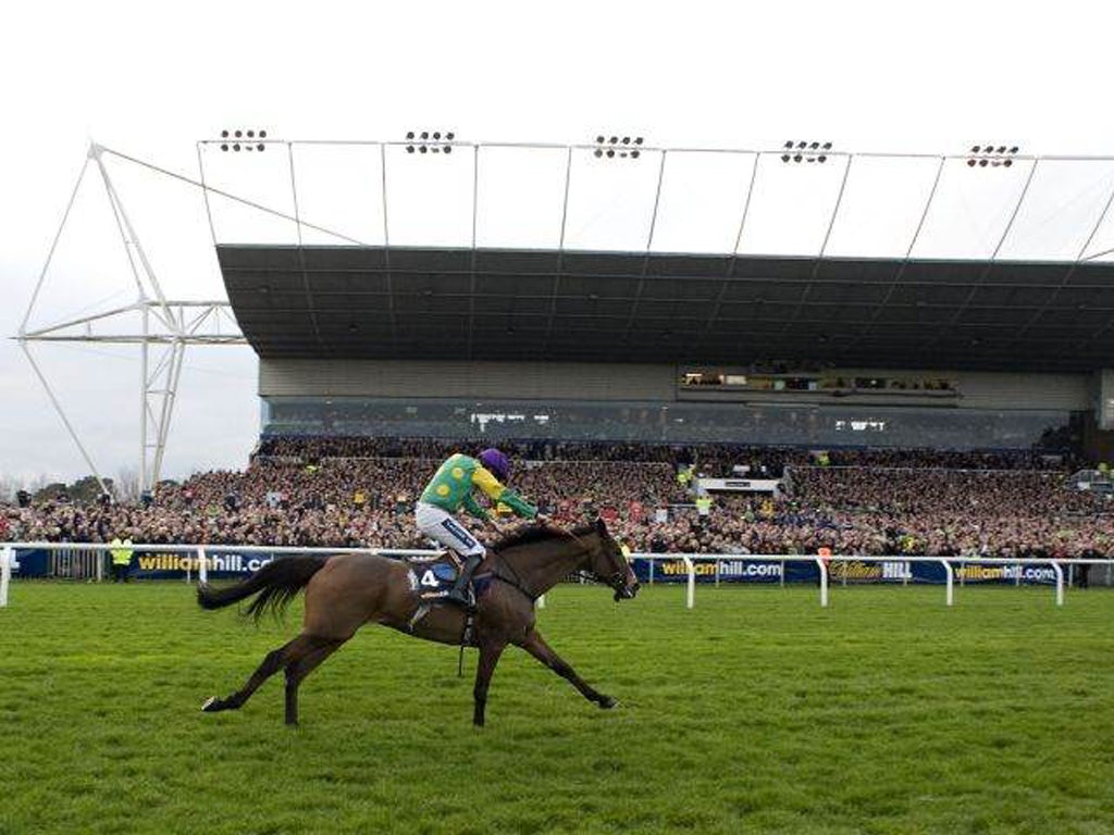 Ruby Walsh riding Kauto Star goes on to win The William Hill King George VI Steeple Chase at Kempton racecourse