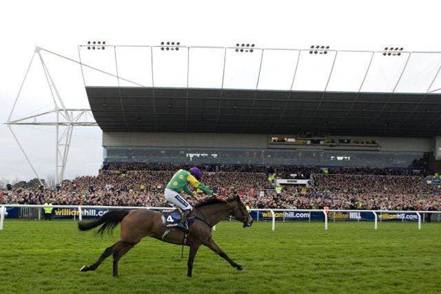 Ruby Walsh riding Kauto Star goes on to win The William Hill King George VI Steeple Chase at Kempton racecourse 