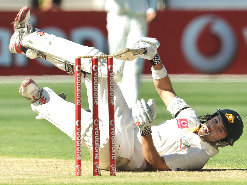 Ed Cowan falls to the ground to avoid a delivery from India’s Zaheer Khan on day one at the MCG