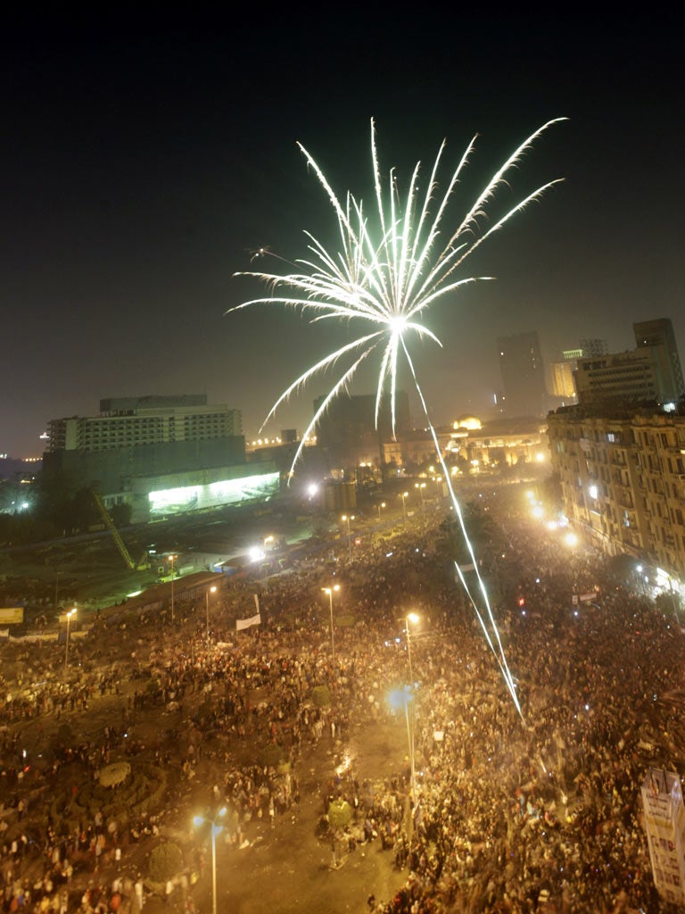 Egyptians in Tahrir Square, Cairo, celebrate the fall of
Hosni Mubarak’s regime