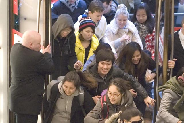 Sales rush: shoppers sprint into Selfridges on the first day
of the sales at the department store’s Oxford Street branch.
Analysts reported a flood of retail tourists from China