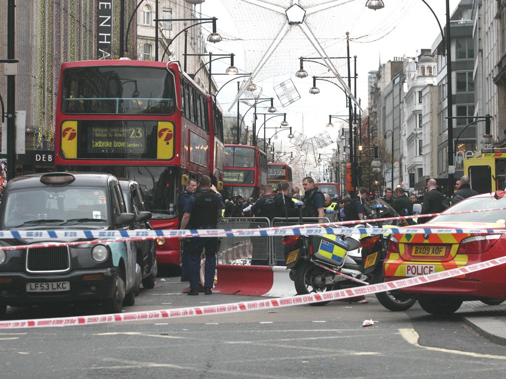 Police cordoned off the crime scene on Oxford Street in London after a man was stabbed to death on Boxing Day
