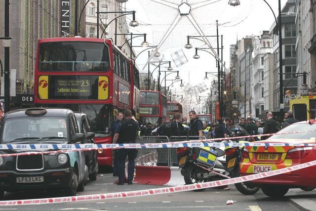Police cordoned off the crime scene on Oxford Street in London after a man was stabbed to death on Boxing Day
