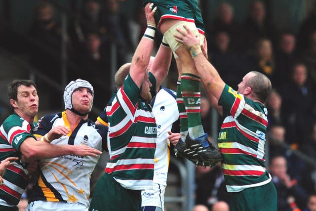 Ed Slater leaps high to win a line-out for Leicester at Sixways