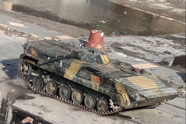 A Syrian tank is seen in this video grab driving through the
city of Homs on Boxing Day