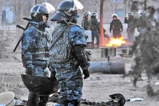 Police patrol Zhanaozen, scene of violent clashes