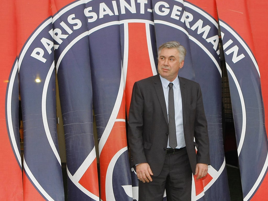 Carlo Ancelotti is unveiled as coach at Paris Saint-Germain yesterday