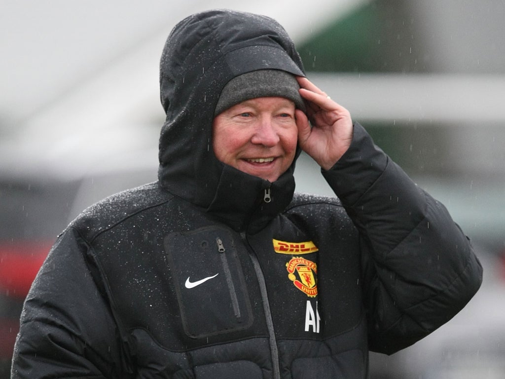 Sir Alex Ferguson keeps the chill out at Carrington yesterday