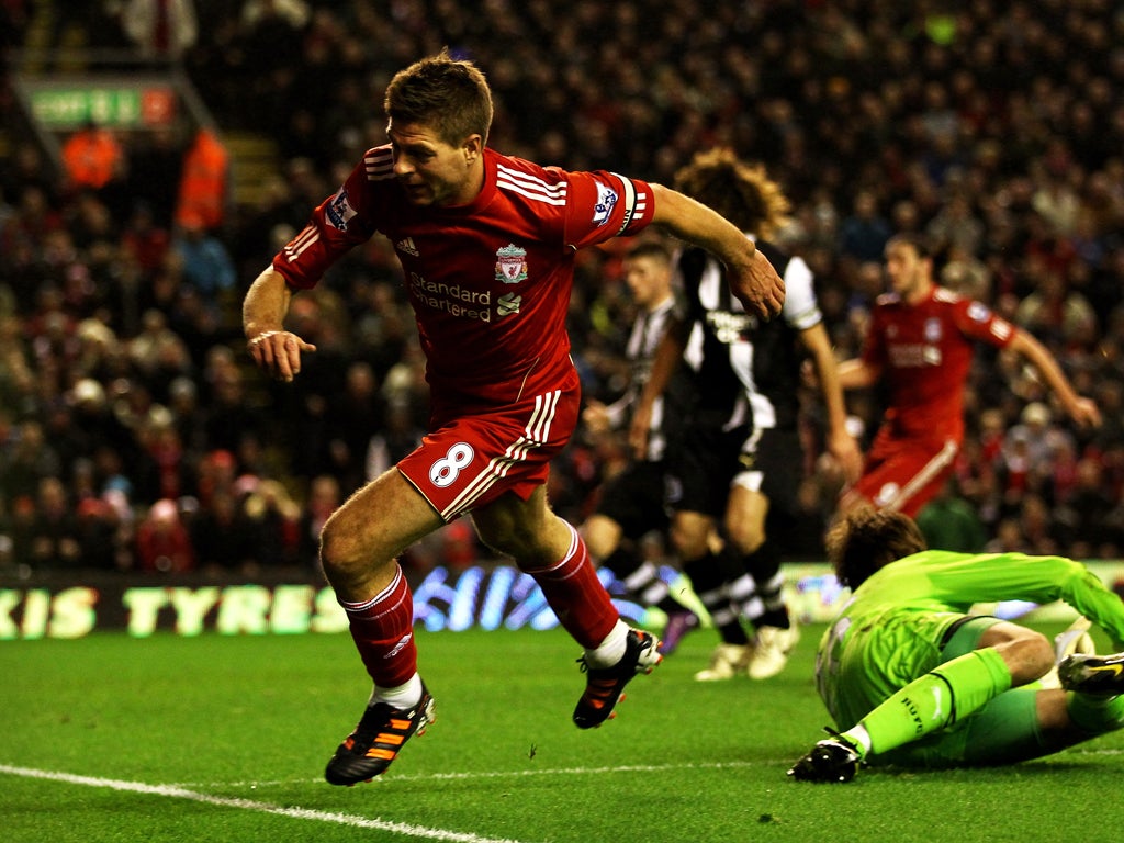 Steven Gerrard celebrates after putting the ball through Tim Krul's legs for Liverpool's third goal