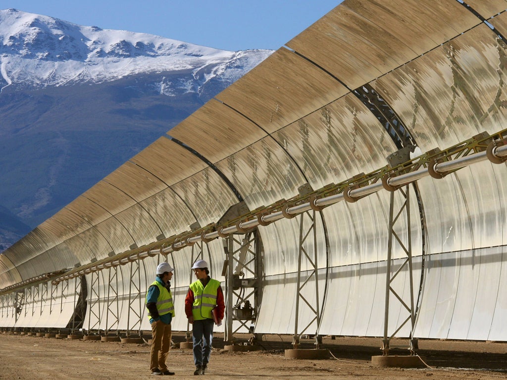 Engineers check some of the Guadix mirrors that will create energy for half a million people