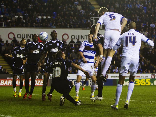 Reading’s Alex Pearce heads the only goal of the game against Ipswich