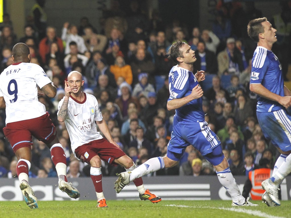 Despair for Chelsea as Darren Bent celebrates Villa’s third
goal with fellow scorer Stephen Ireland