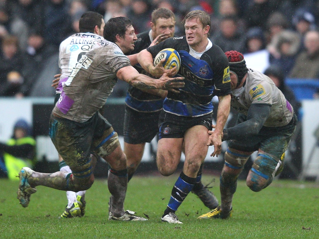 Bath’s Michael Claassens slips Nick Kennedy (right), andDeclan Danaher at the Recreation Ground