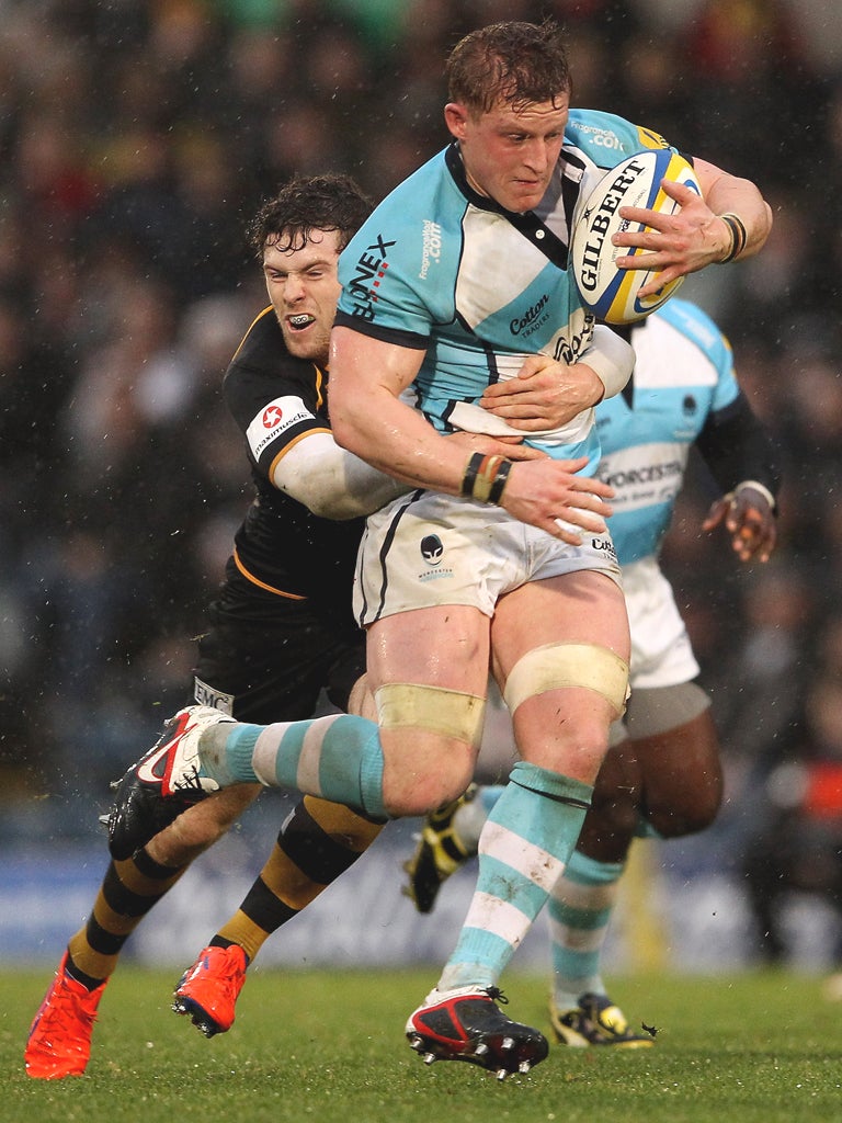 Worcester’s Jake Abbott is tackled by Elliot Daly