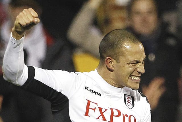 Bobby Zamora punches the air afters coring a last-gasp winner against Arsenal at Craven Cottage last night