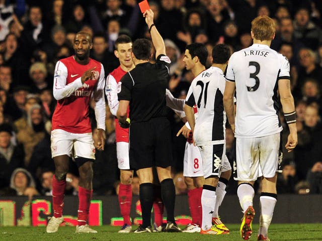 Johan Djourou was shown a second yellow for pulling back Zamora