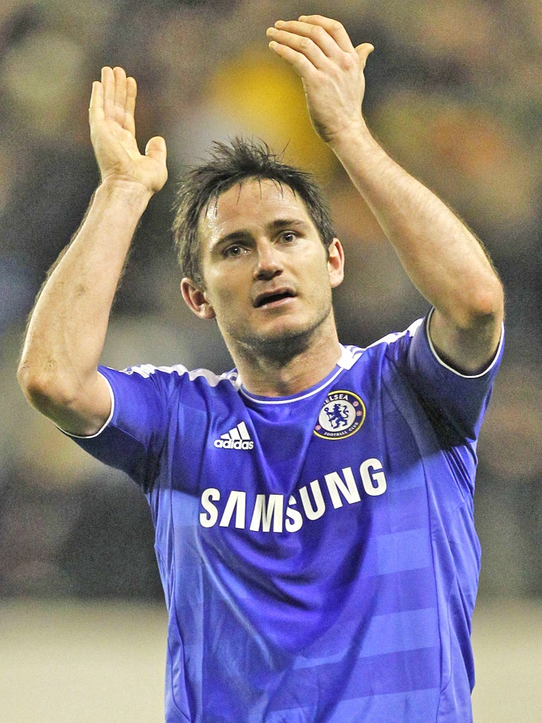 Frank Lampard applauds the Chelsea fans after beating Wolves