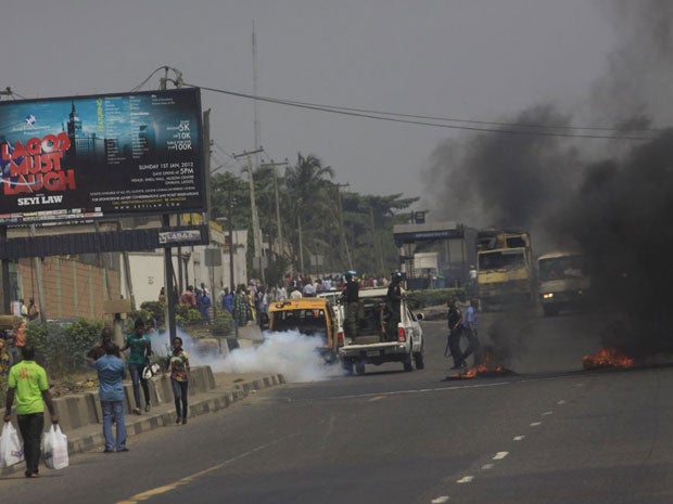 Angry protesters lit bonfires and vandalised at least three petrol stations in Lagos