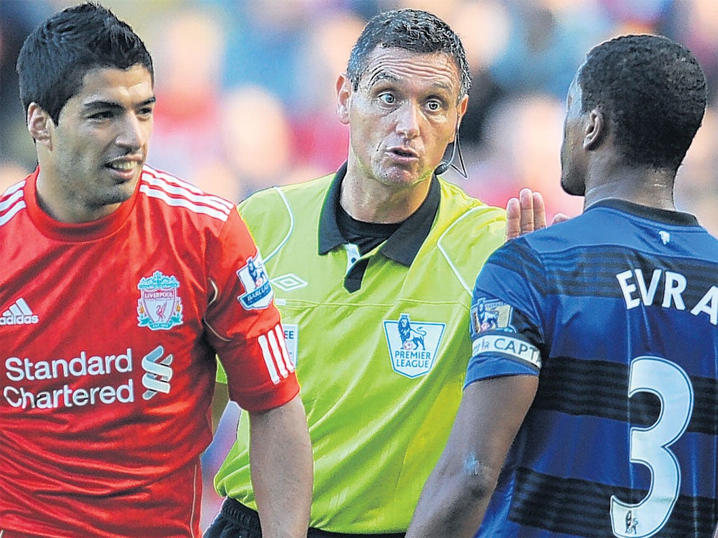 15 October 2011: Luis Suarez clashes with Patrice Evra and allegedly racially abuses him