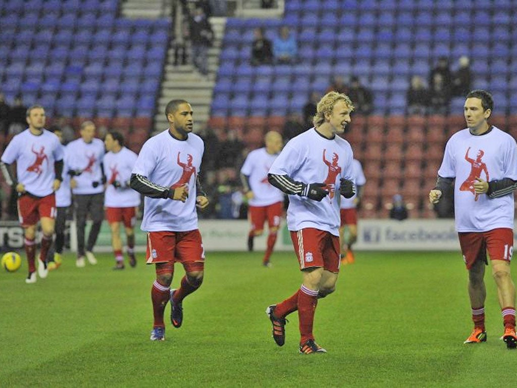 21 December: Liverpool players wear T-shirts in support of Suarez at Wigan