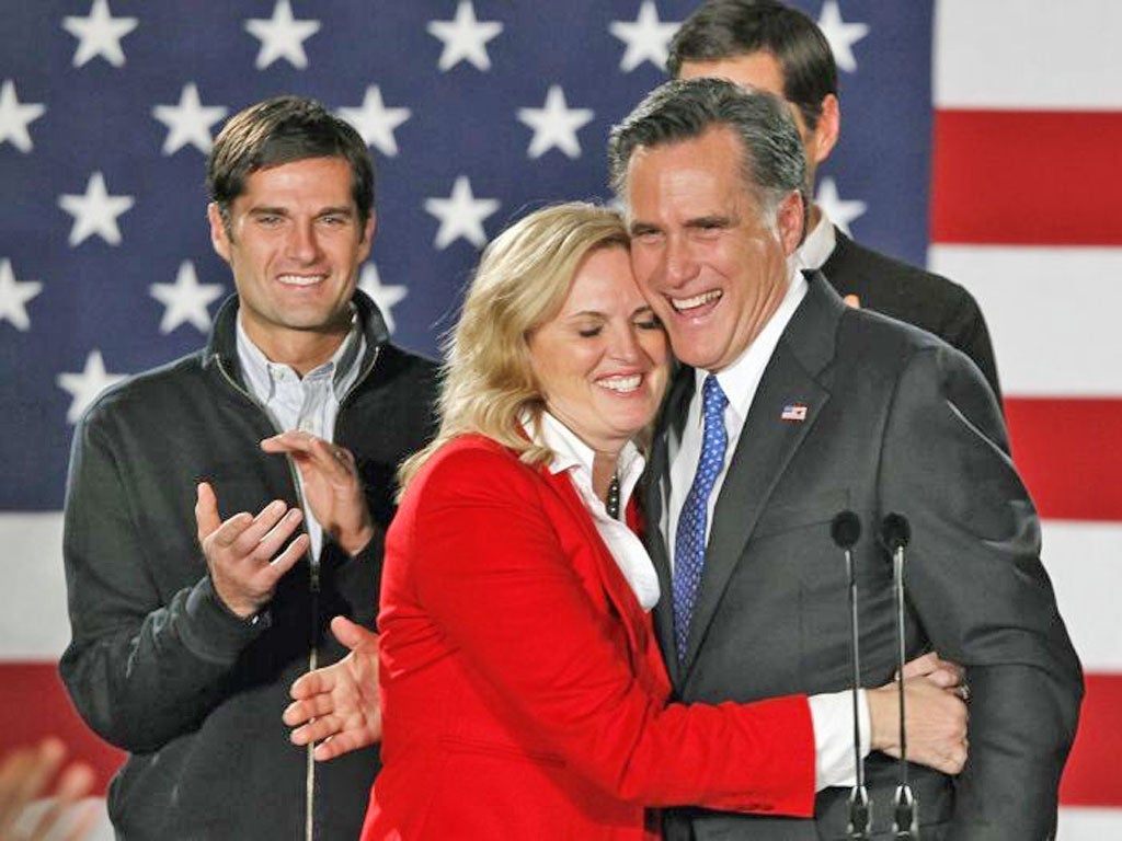 Mitt Romney celebrates with his wife Ann and sons after winning by just an eight-point margin