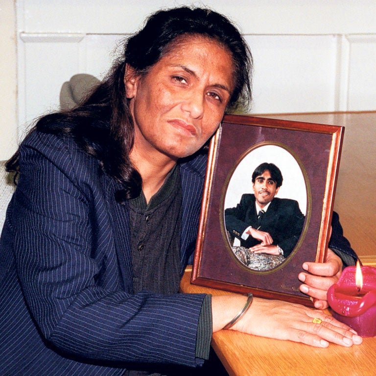 Sukhdev Reel clutches a portrait of her son Ricky, who drowned on 14 October 1997