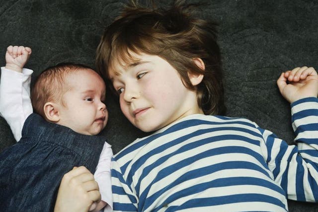 Reuben, five, with his seven-week-old sister Floren