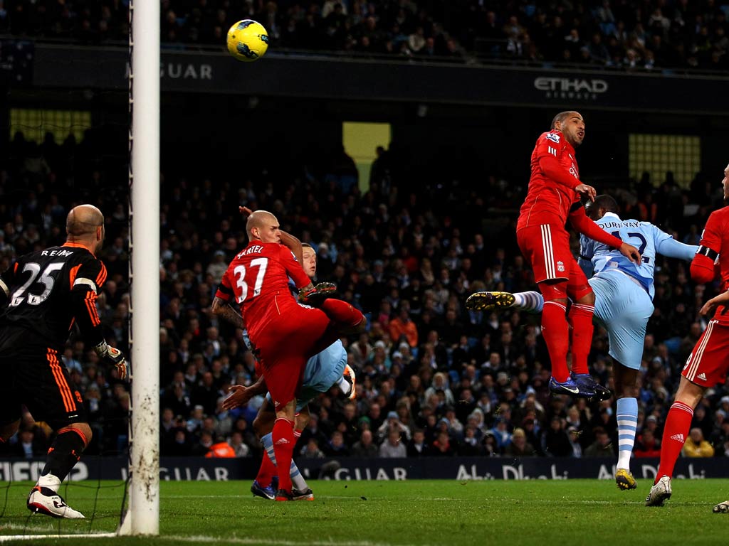 Yaya Toure scores from a corner against Liverpool