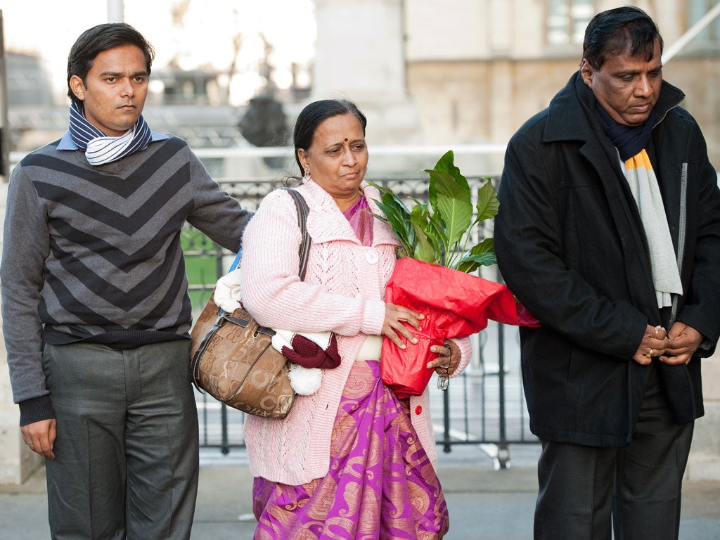 The mother of student Anuj Bidve, Yogini Bidve (centre), arrives at Parliament flanked by father Subhash Bidve (right) and brother-in-law Rakesh Sonawane