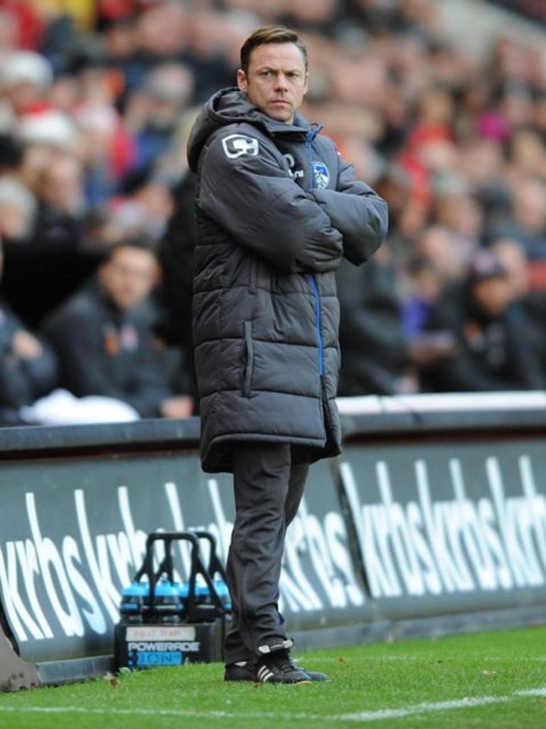 Oldham Athletic manager Paul Dickov deep in thought during
the League One match at The Valley