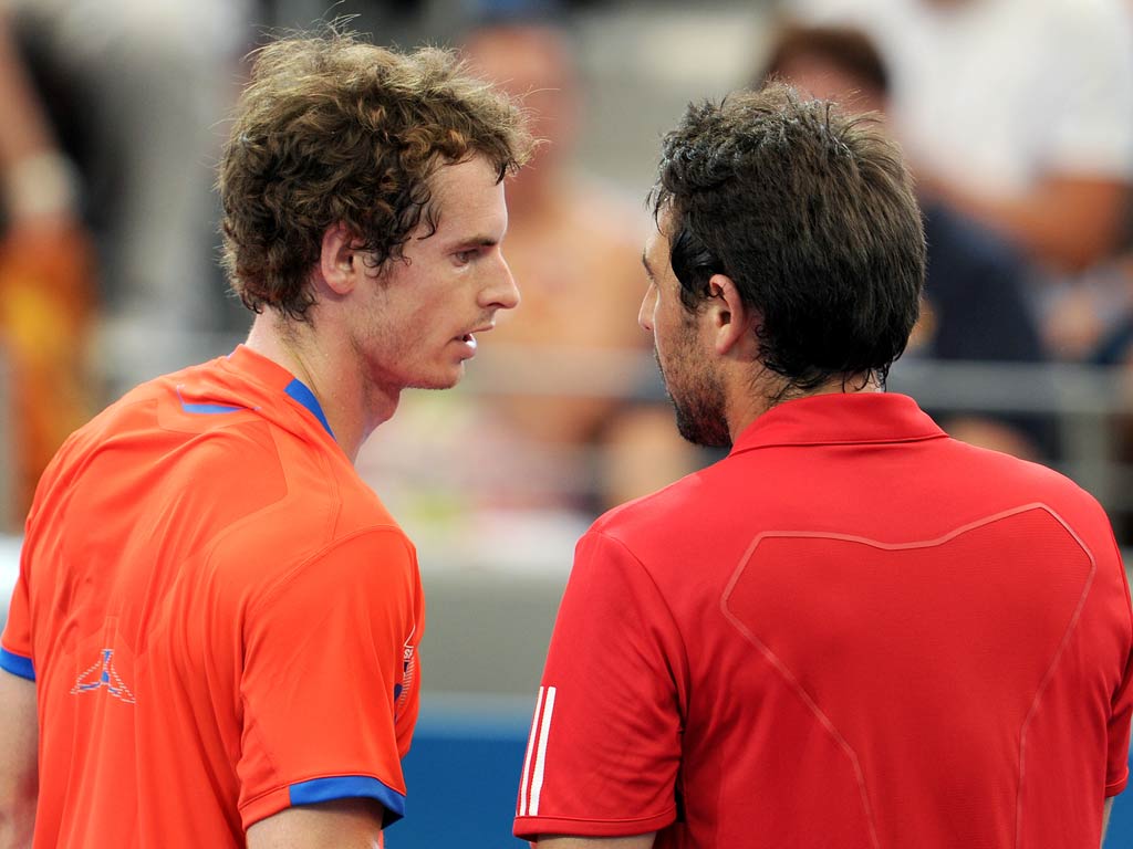Andy Murray is congratulated by Marcos Baghdatis in Brisbane