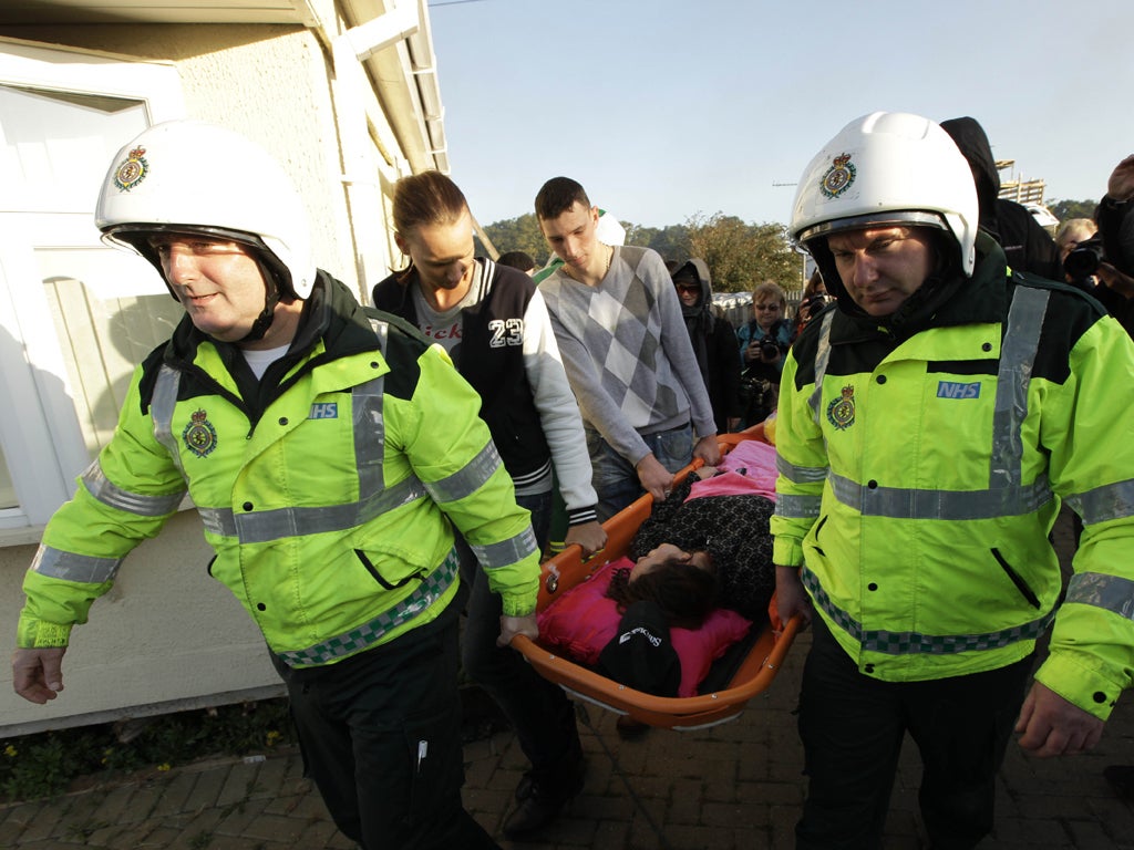 An injured traveller is taken from the Dale Farm site during the mass
eviction in October