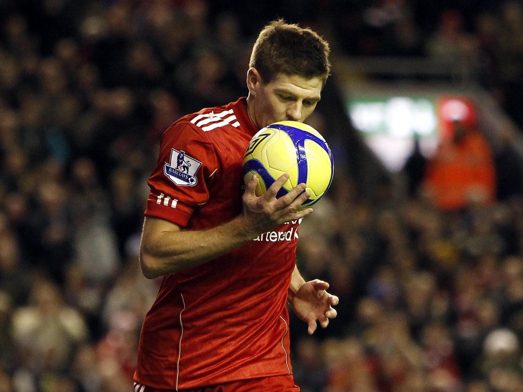 Steven Gerrard kisses the ball after scoring Liverpool's second