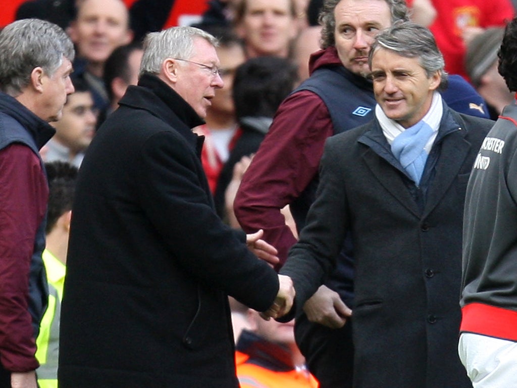 Sir Alex Ferguson greets Roberto Mancini after United beat City 2-1 at Old Trafford last season courtesy of Wayne Rooney's wonder goal