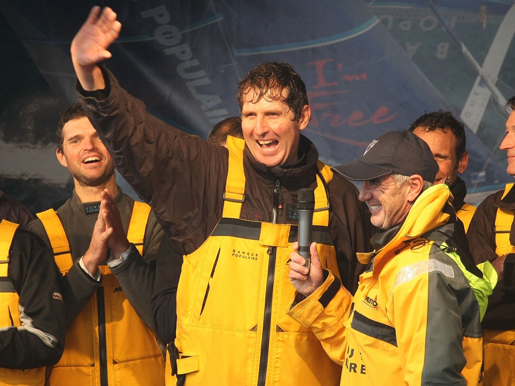 Brian Thompson, arm raised, salutes the Brest crowd