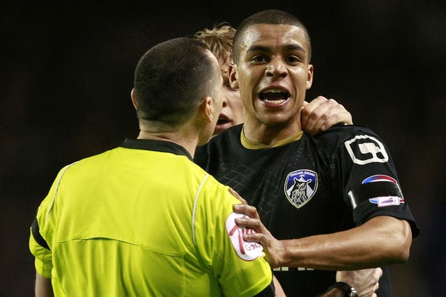 Oldham defender Tom Adeyemi reacts to alleged abuse