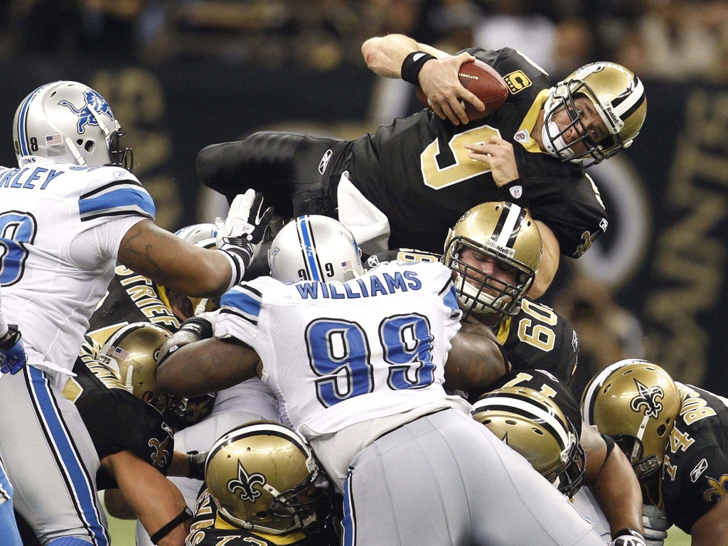 The New Orleans Saints quarterback Drew Brees tries to make headway against the Detroit Lions in NFC wild-card play-off game
