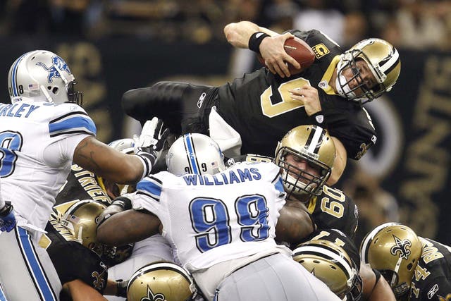 The New Orleans Saints quarterback Drew Brees tries to make headway against the Detroit Lions in NFC wild-card play-off game