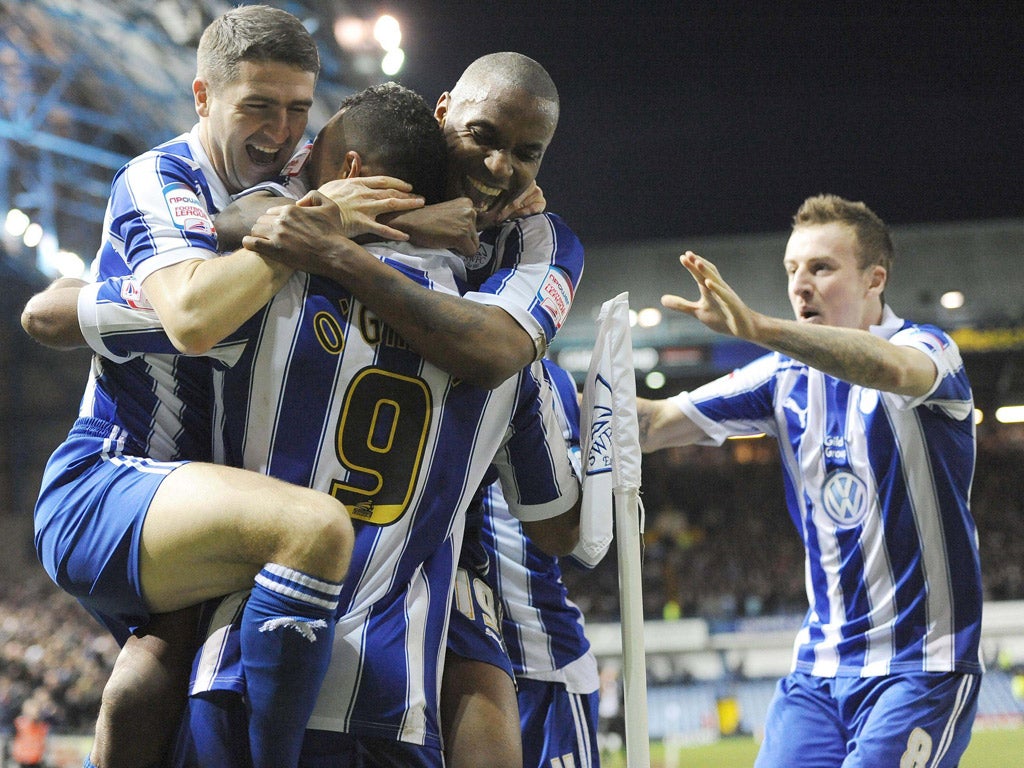 Sheffield Wednesday’s Chris O’Grady (No9)
celebrates with his team-mates after scoring
against West Ham at Hillsborough yesterday