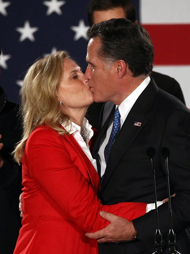 It’s in his kiss: Mitt Romney embraces his wife, Ann