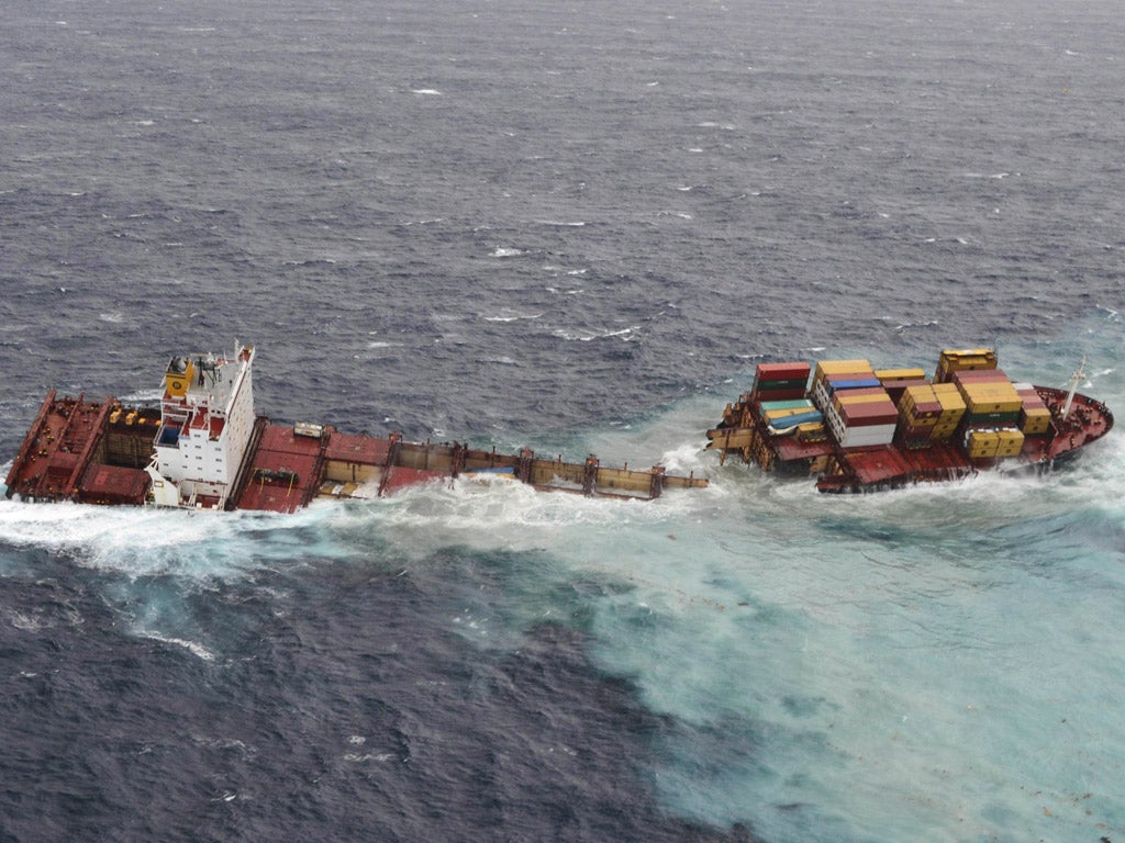 Stormy seas batter the stricken container ship Rena which has been wedged on a reef off New Zealand’s North Island for the past three months