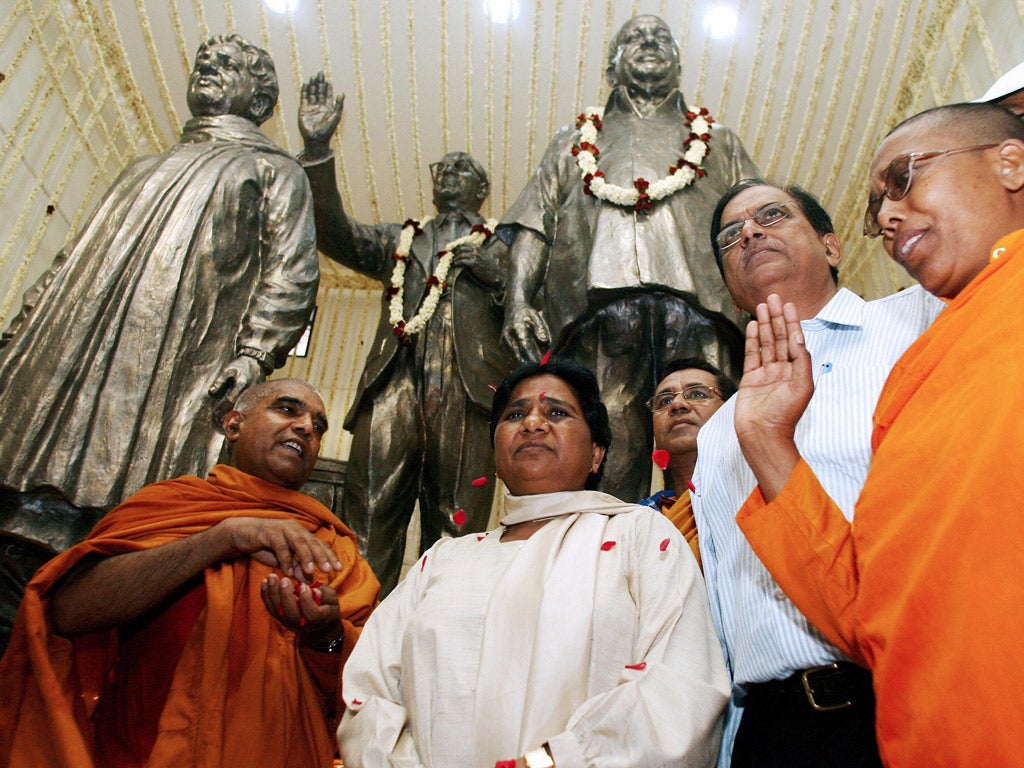 India’s ‘Prime Minister-in-waiting’ Mayawati, second from left,attending a prayer in front of statues – including one of herself– in New Delhi