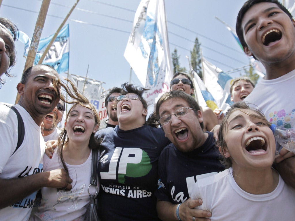 Supporters celebrate at the news that President Cristina Fernandez de Kirchner, did not have cancer