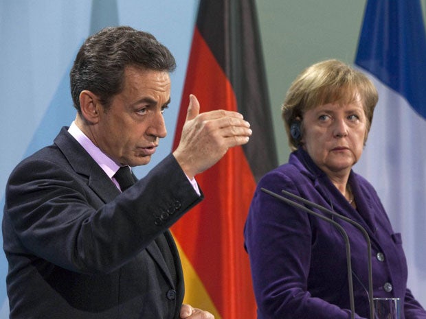 French President Nicolas Sarkozy and German Chancellor Angela Merkel at the meeting today