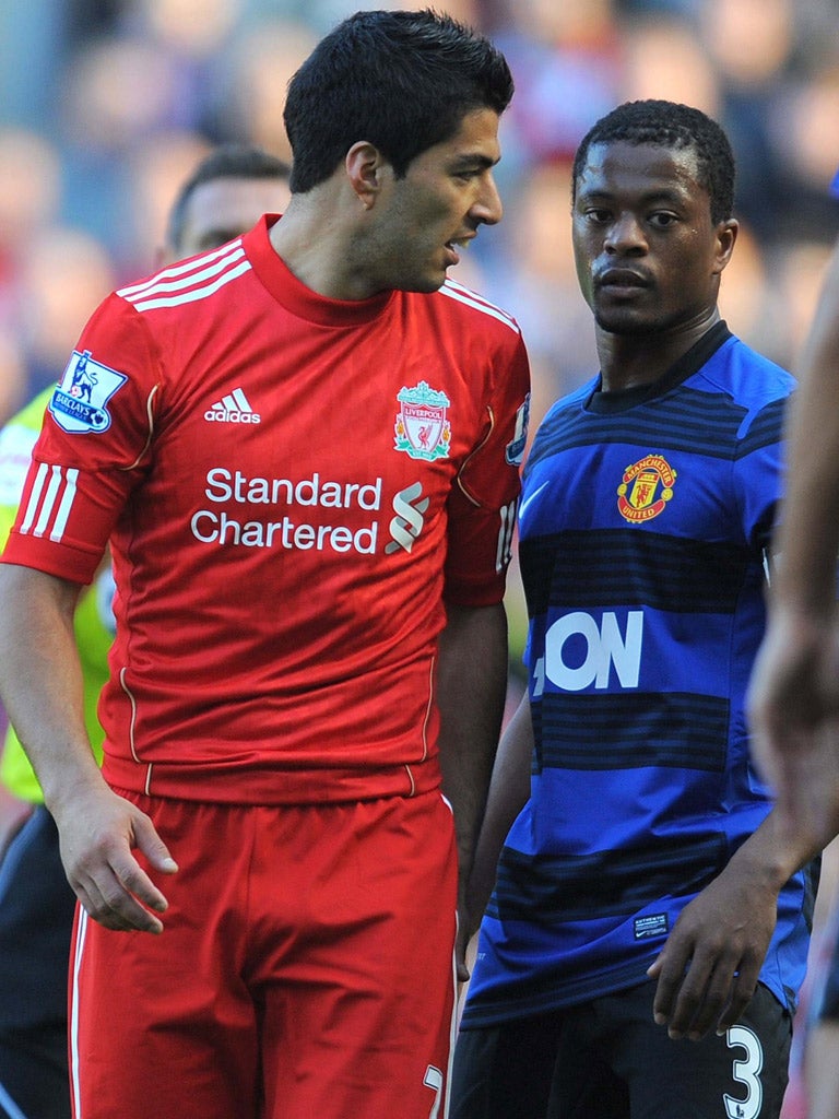 Luis Suarez and Patrice Evra clash during United’s last visit to Anfield, in the league in October