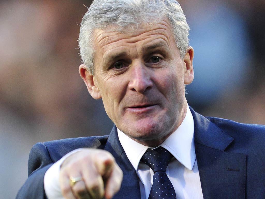 Mark Hughes has signed a two-and-a-half year contract with QPR